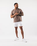 Man wearing white mesh 6" men's workout shorts 